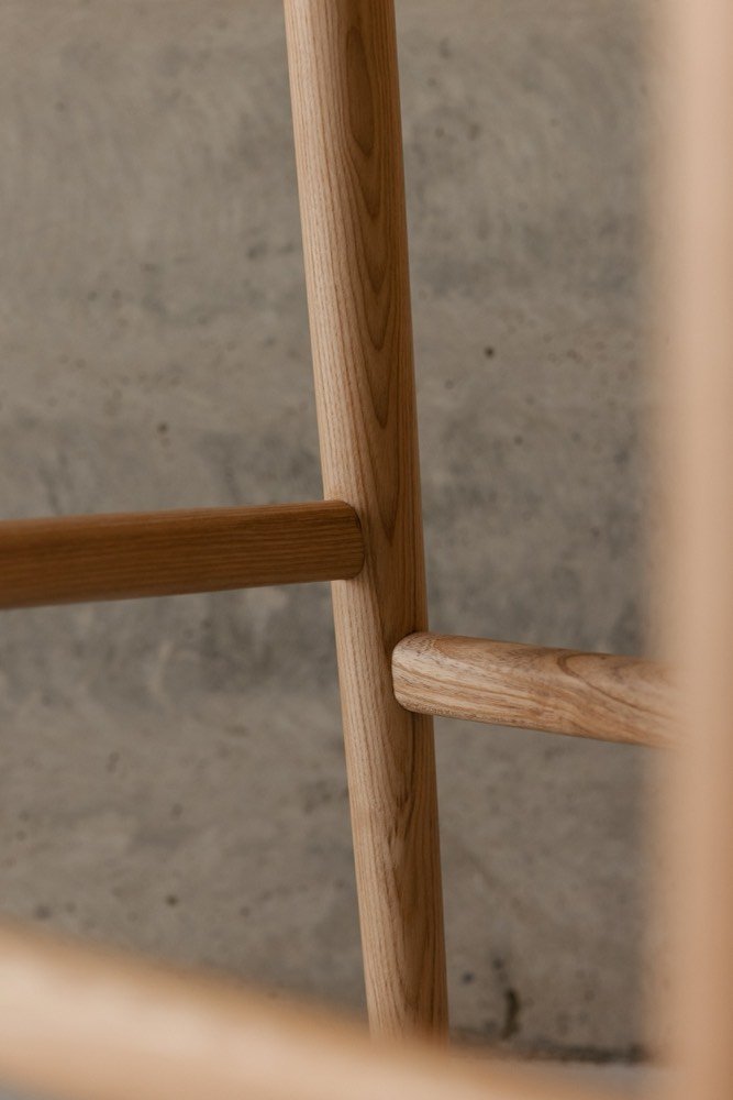 Close view of the hand-shaped arm joinery