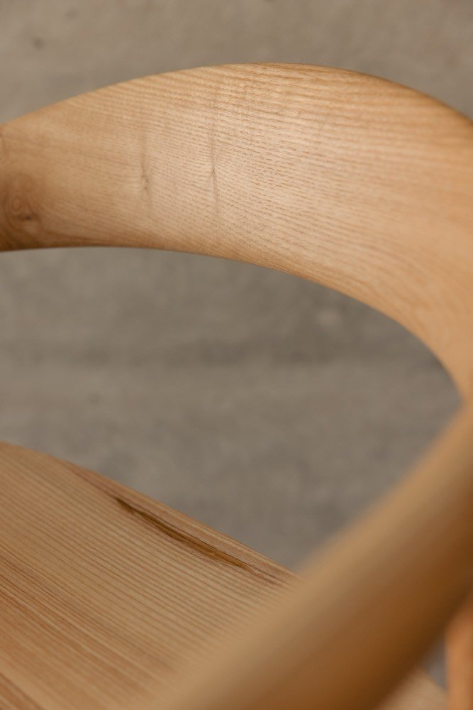 Sculpted seat and back of the ash barstool