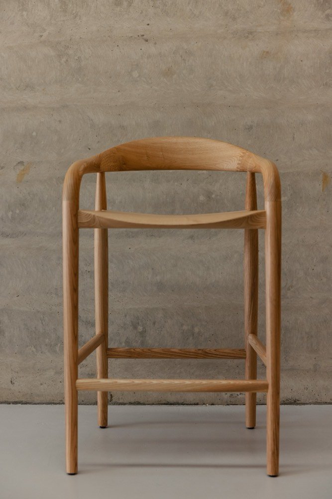 Solid ash barstool, three-quarter view